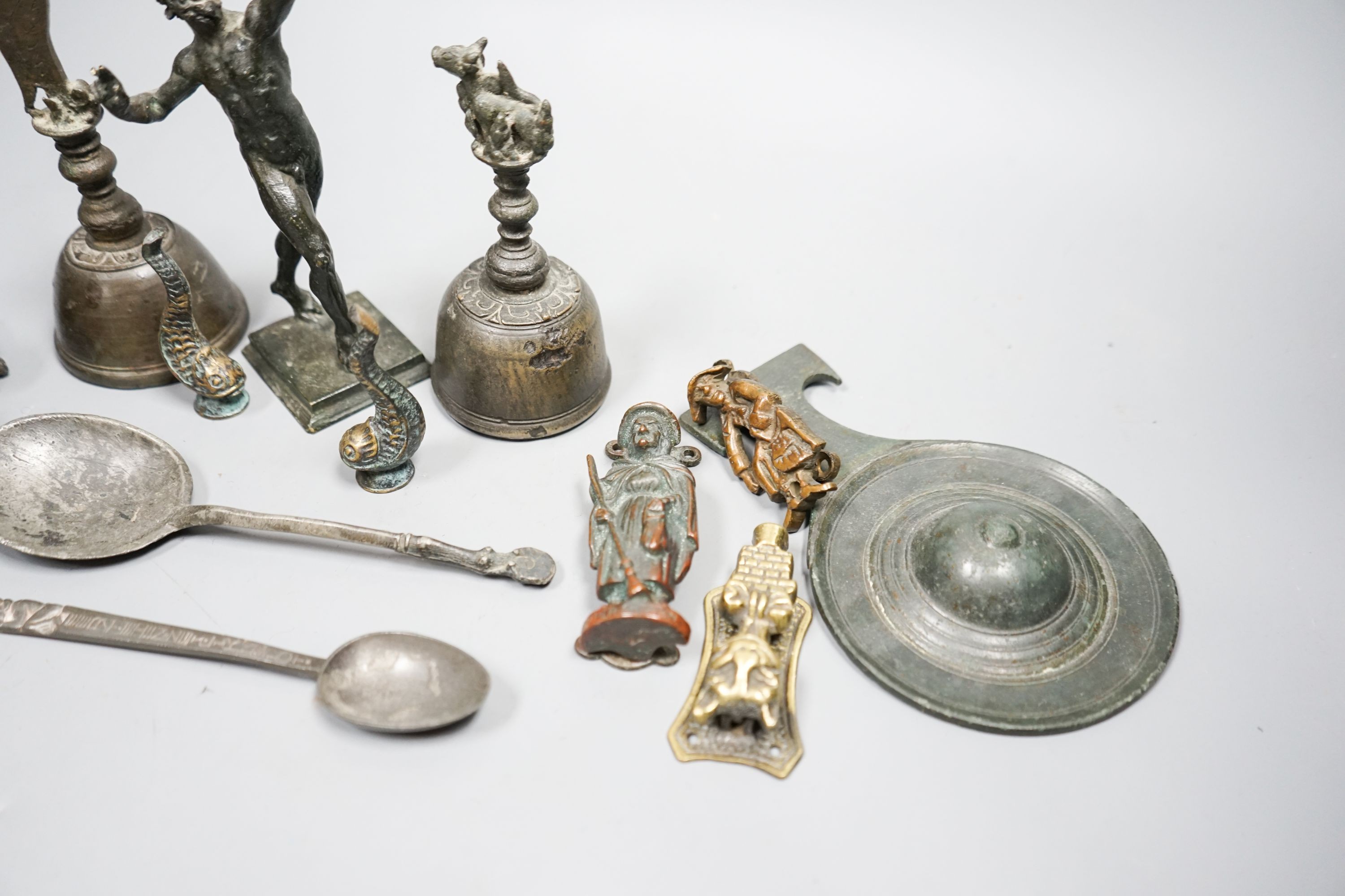 A small quantity of decorative metalware, including two bronze table bells, a bronze faun, 17cm, pewter spoons, etc.